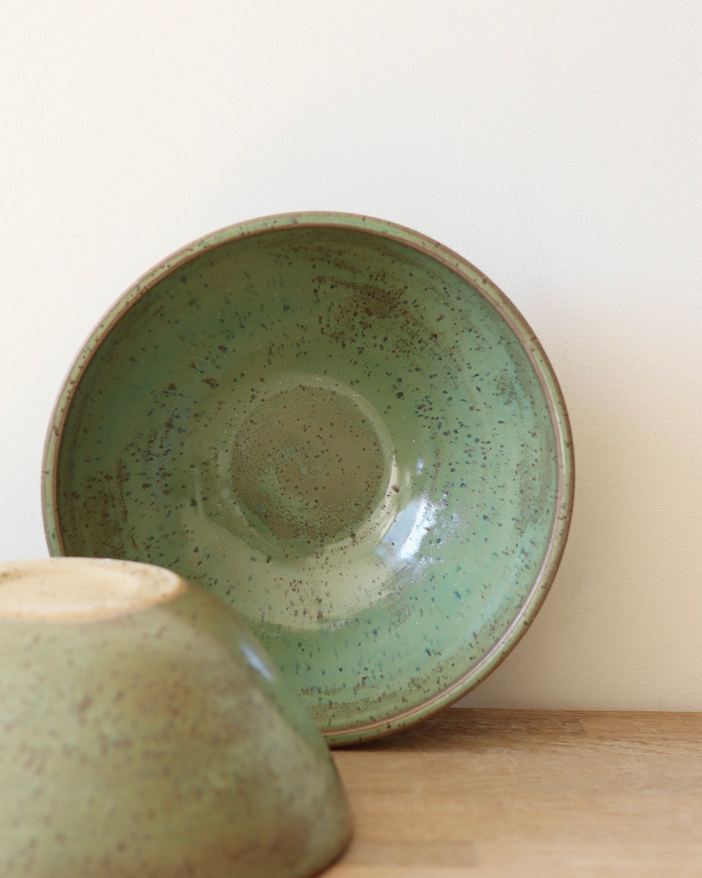 handmade ceramic speckled stoneware bowl set in green tea glaze