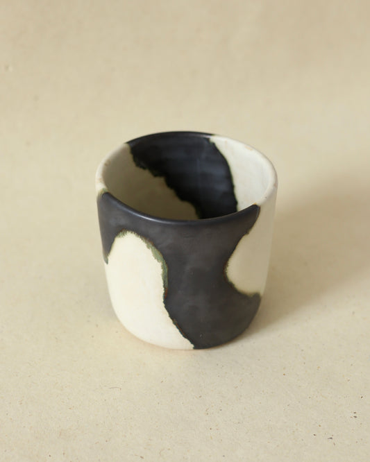 Handmade and wheelthrown ceramic white stoneware cup in a playful matte alabaster metallic glaze, perfect for coffee and tea