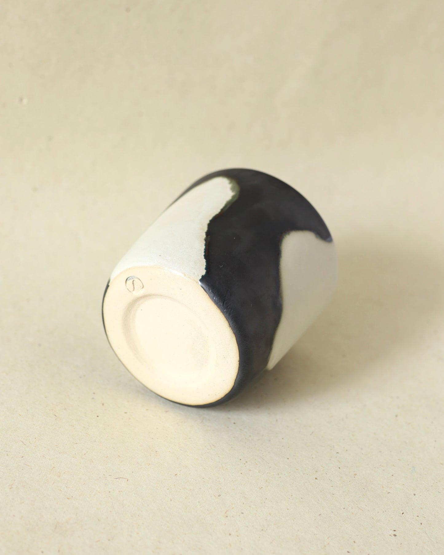 Handmade and wheelthrown ceramic white stoneware cup in a playful matte alabaster metallic glaze, perfect for coffee and tea