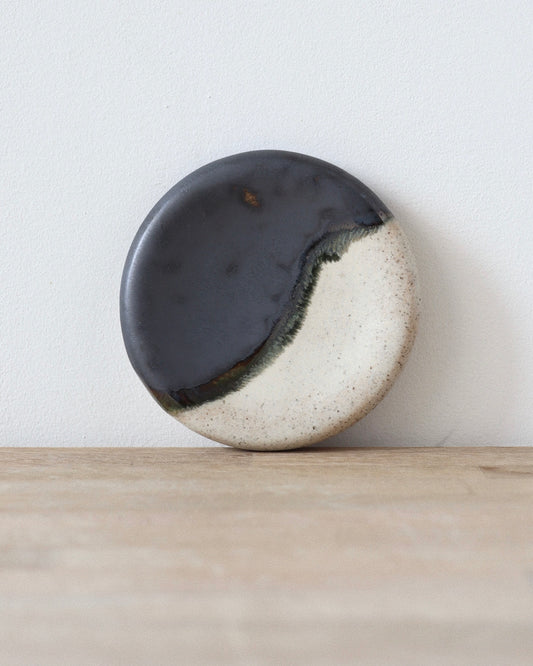 Mirage Jewelry Dish – handmade white speckled stoneware dish finished with matte white and a black metallic glaze, crafted in Amsterdam by Zeyah Ceramics.