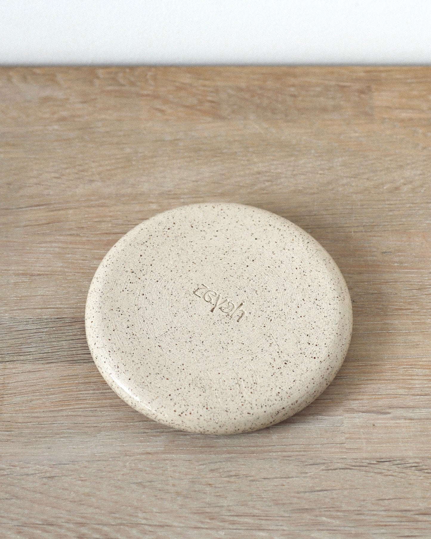 Sora Jewelry Dish – handmade white speckled stoneware jewelry dish with clear glaze, crafted in Amsterdam by Zeyah Ceramics.