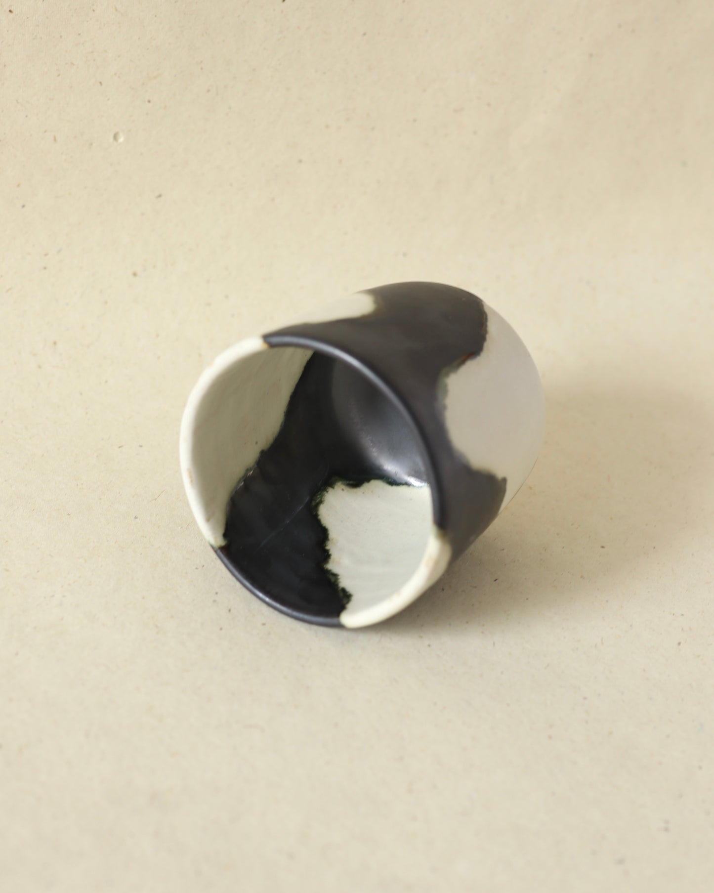 Handmade and wheelthrown ceramic white stoneware cup in a playful matte alabaster metallic glaze, perfect for coffee and tea