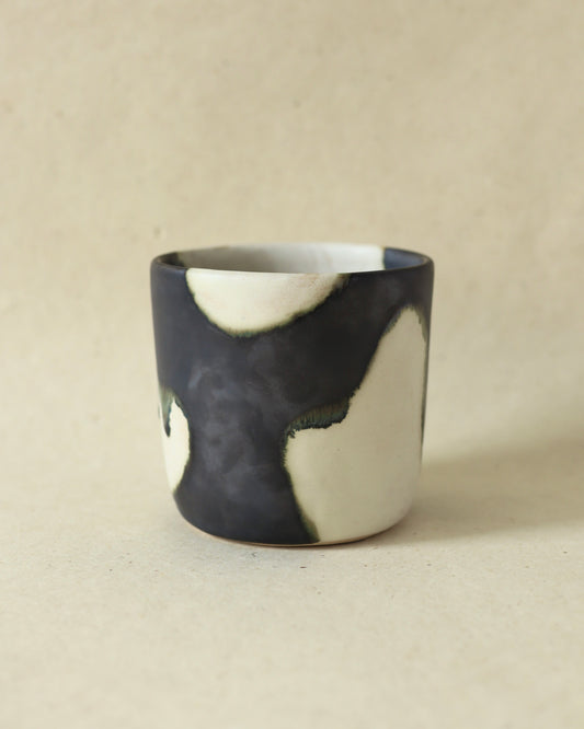 Handmade and wheelthrown ceramic white stoneware cup in a playful matte alabaster metallic glaze, perfect for coffee and tea