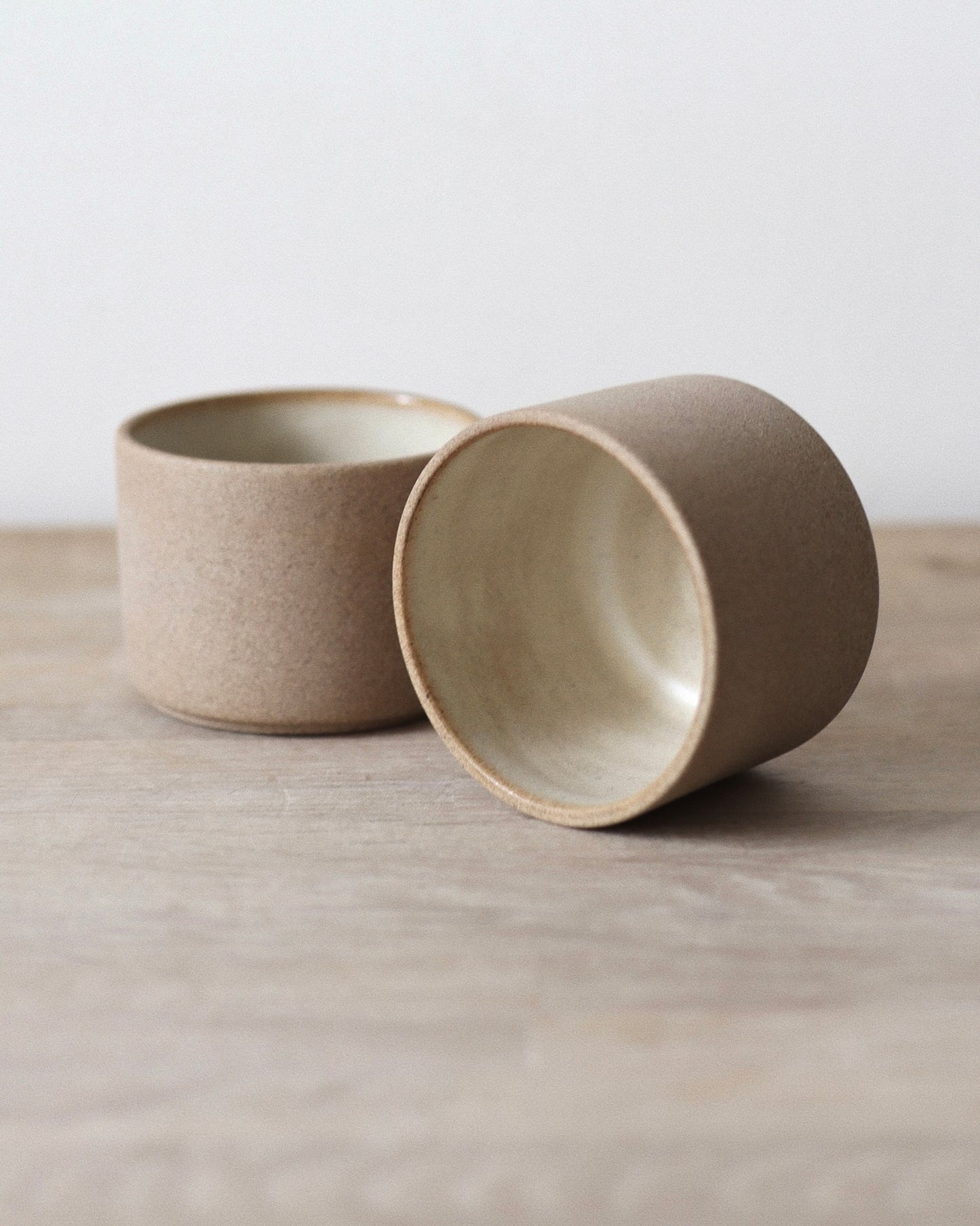 Terra Espresso Cup Set – handmade toffee stoneware cups with raw unglazed exterior and matte white glazed interior, crafted in Amsterdam by Zeyah Ceramics.