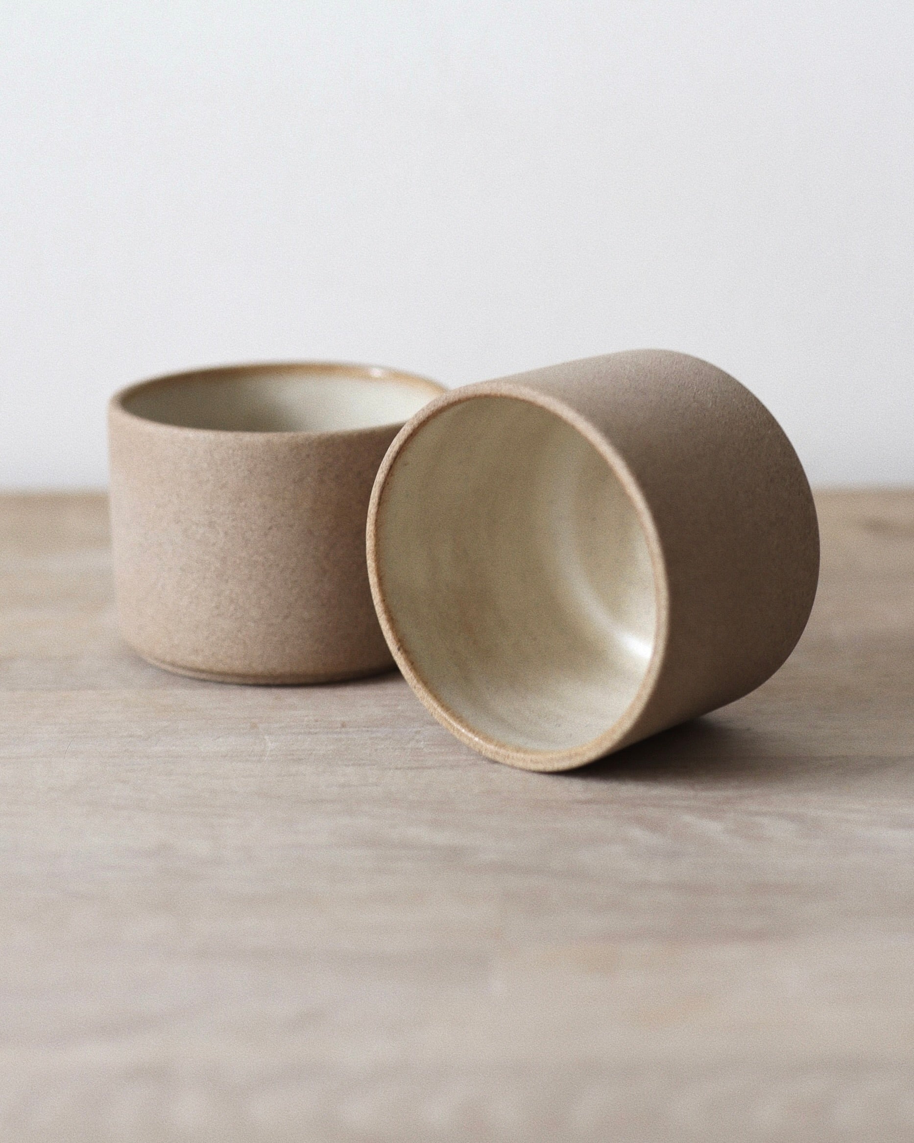 Terra Espresso Cup Set – handmade toffee stoneware cups with raw unglazed exterior and matte white glazed interior, crafted in Amsterdam by Zeyah Ceramics.