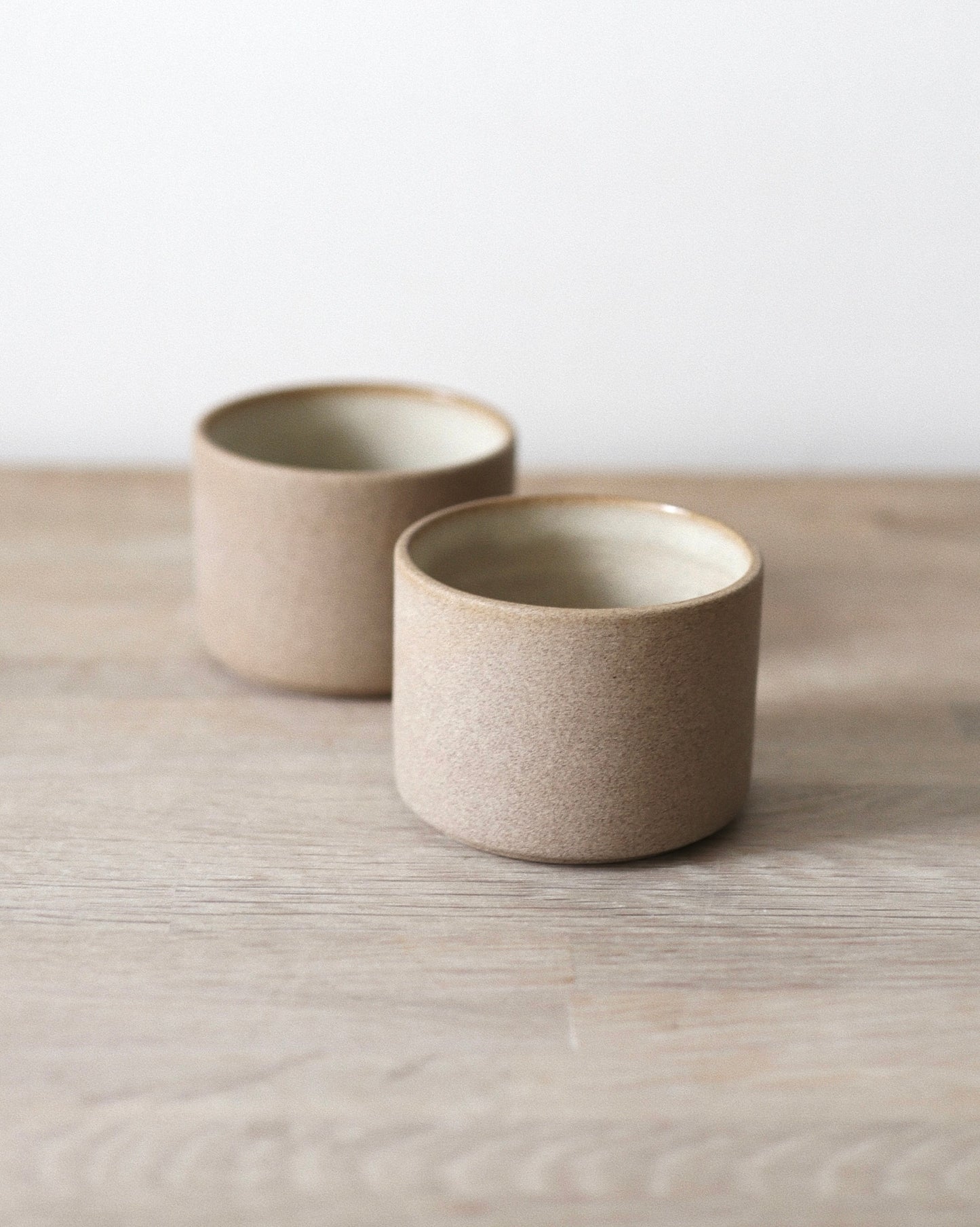Terra Espresso Cup Set – handmade toffee stoneware cups with raw unglazed exterior and matte white glazed interior, crafted in Amsterdam by Zeyah Ceramics.