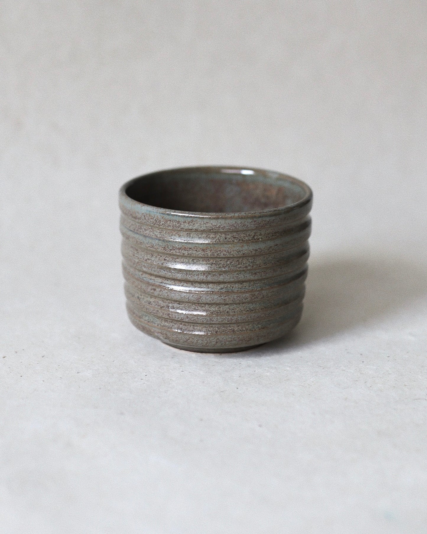 Terra Espresso Cup – handmade stoneware espresso cup with a brown, green glaze, 180 ml capacity, crafted in Amsterdam by Zeyah Ceramics.