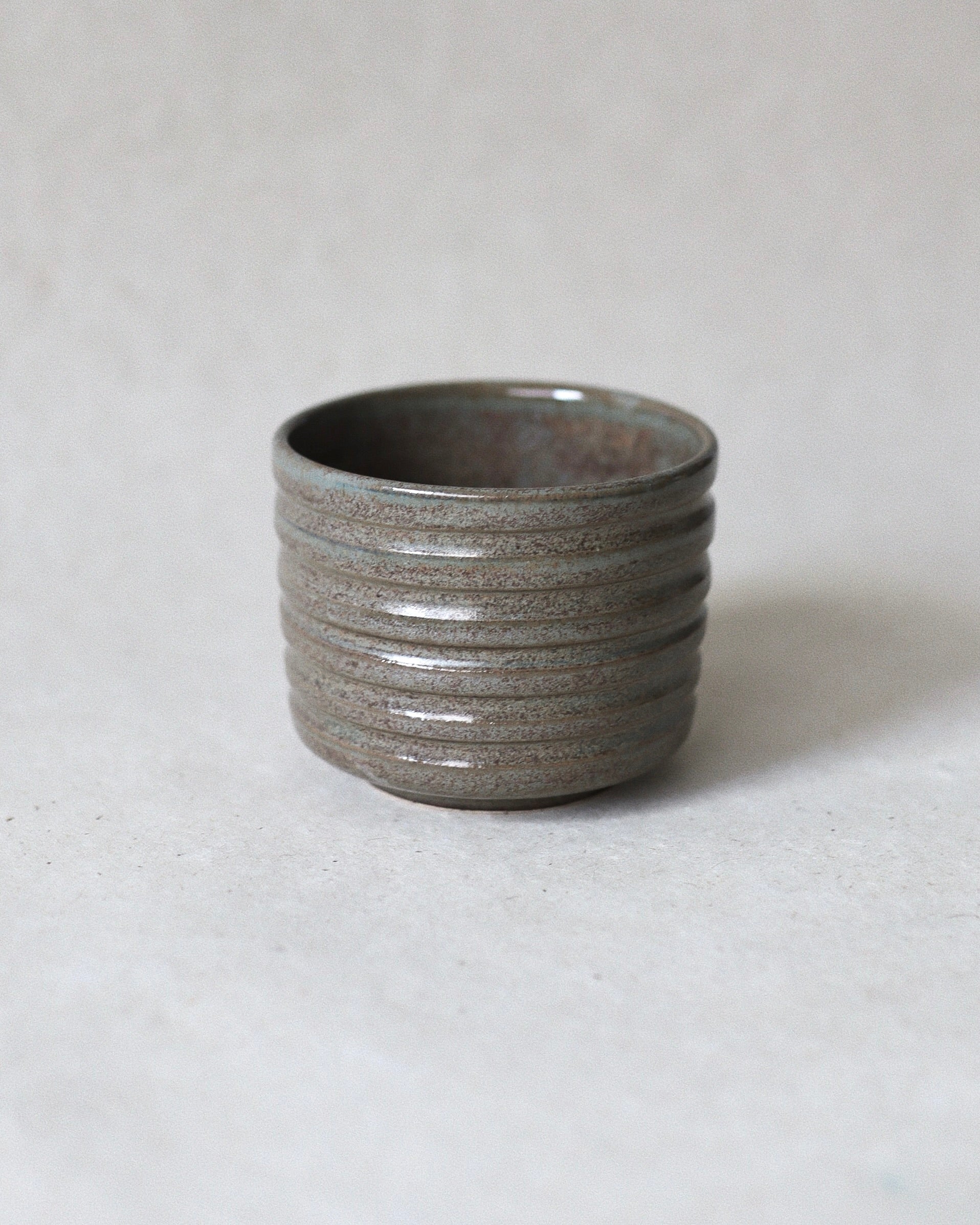 Terra Espresso Cup – handmade stoneware espresso cup with a brown, green glaze, 180 ml capacity, crafted in Amsterdam by Zeyah Ceramics.