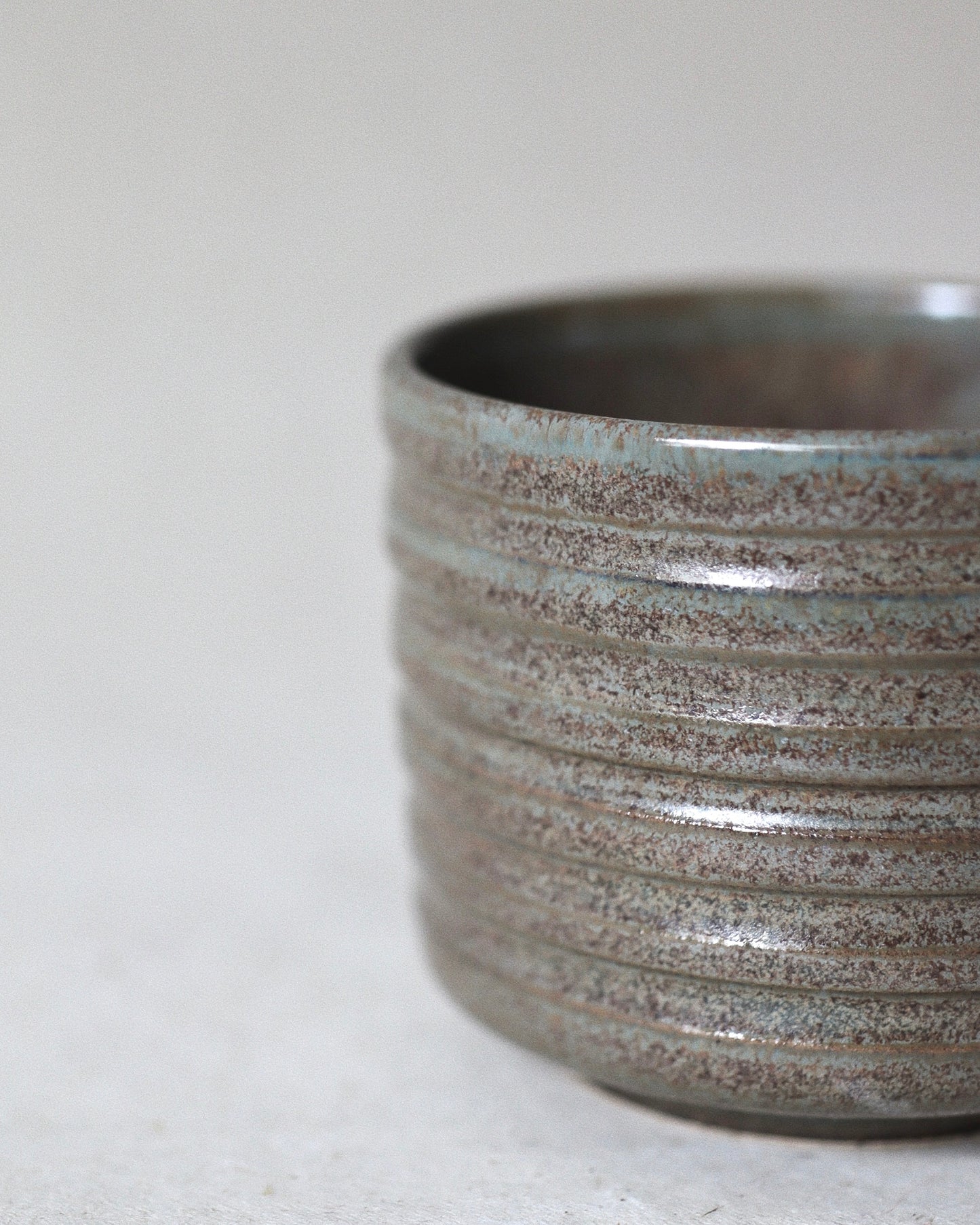 Terra Espresso Cup – handmade stoneware espresso cup with a brown, green glaze, 180 ml capacity, crafted in Amsterdam by Zeyah Ceramics.