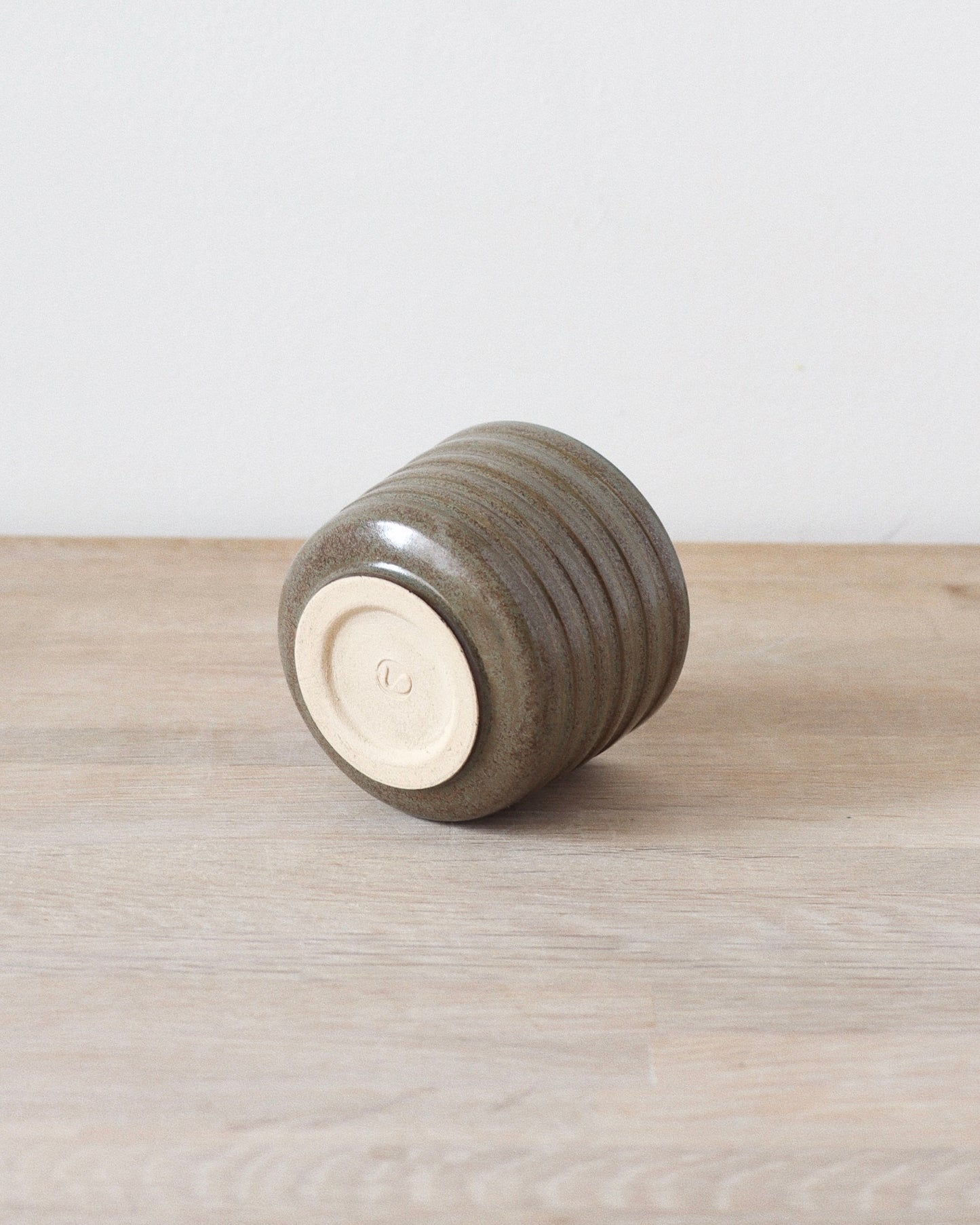 Terra Espresso Cup – handmade stoneware espresso cup with a brown, green glaze, 180 ml capacity, crafted in Amsterdam by Zeyah Ceramics.