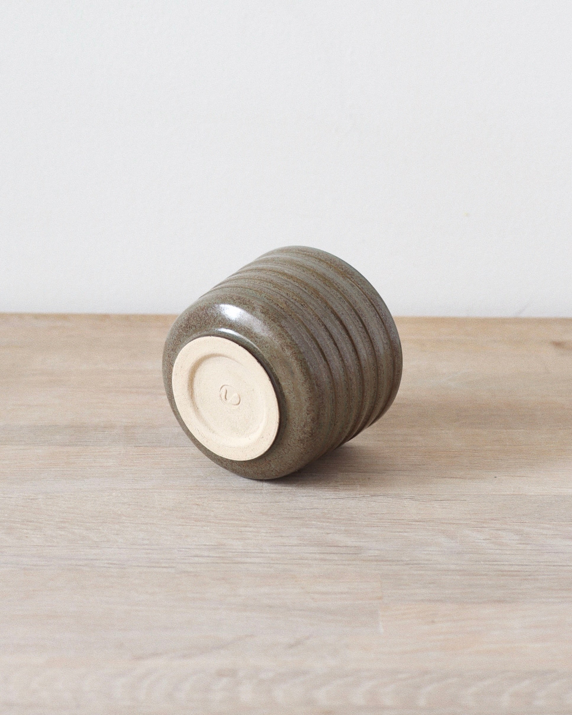 Terra Espresso Cup – handmade stoneware espresso cup with a brown, green glaze, 180 ml capacity, crafted in Amsterdam by Zeyah Ceramics.